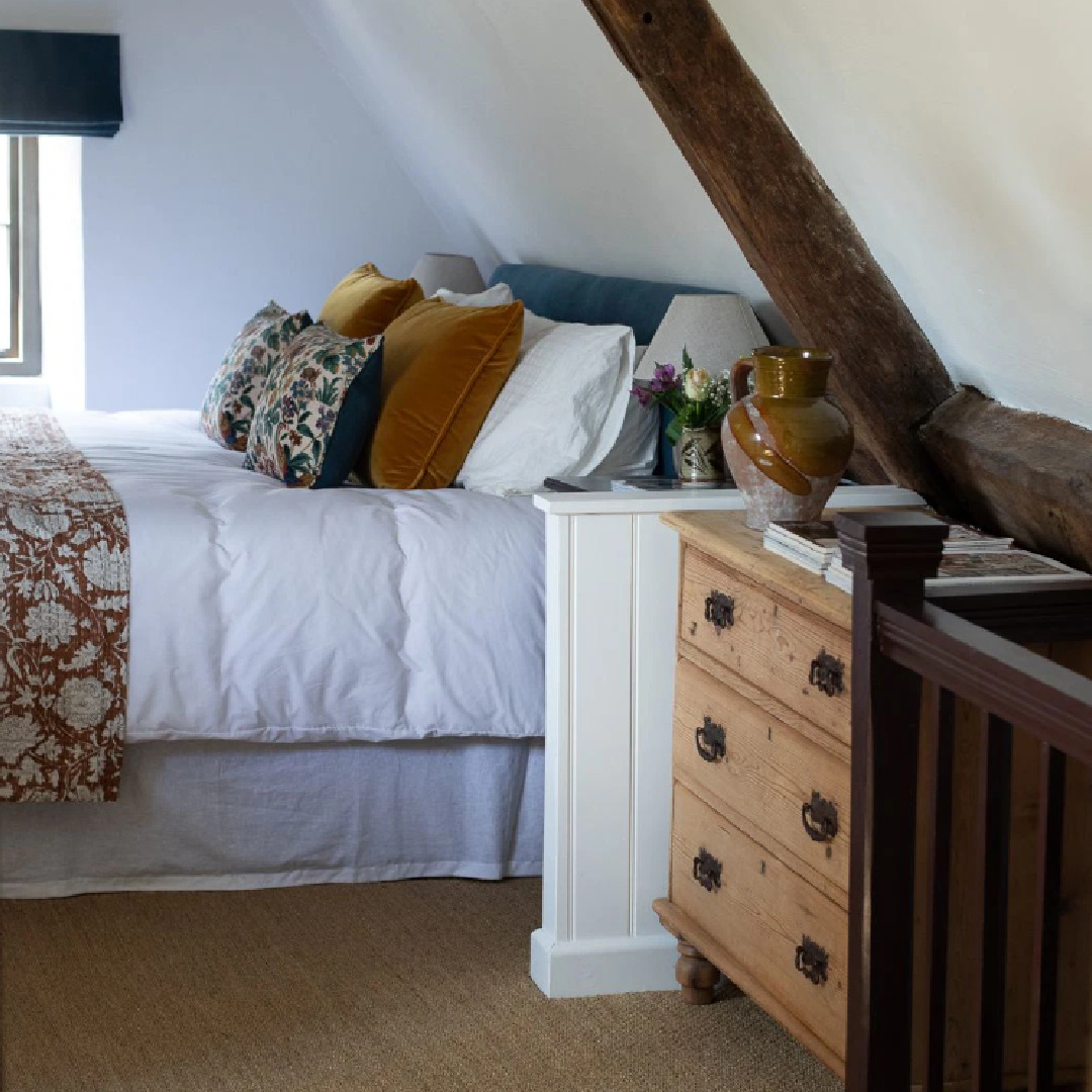 Bedroom in a Cotswolds stone cottage called Armada Cottage. It dates to 1489 with reimagined interiors by Beth Dadswell (Imperfect Interiors).