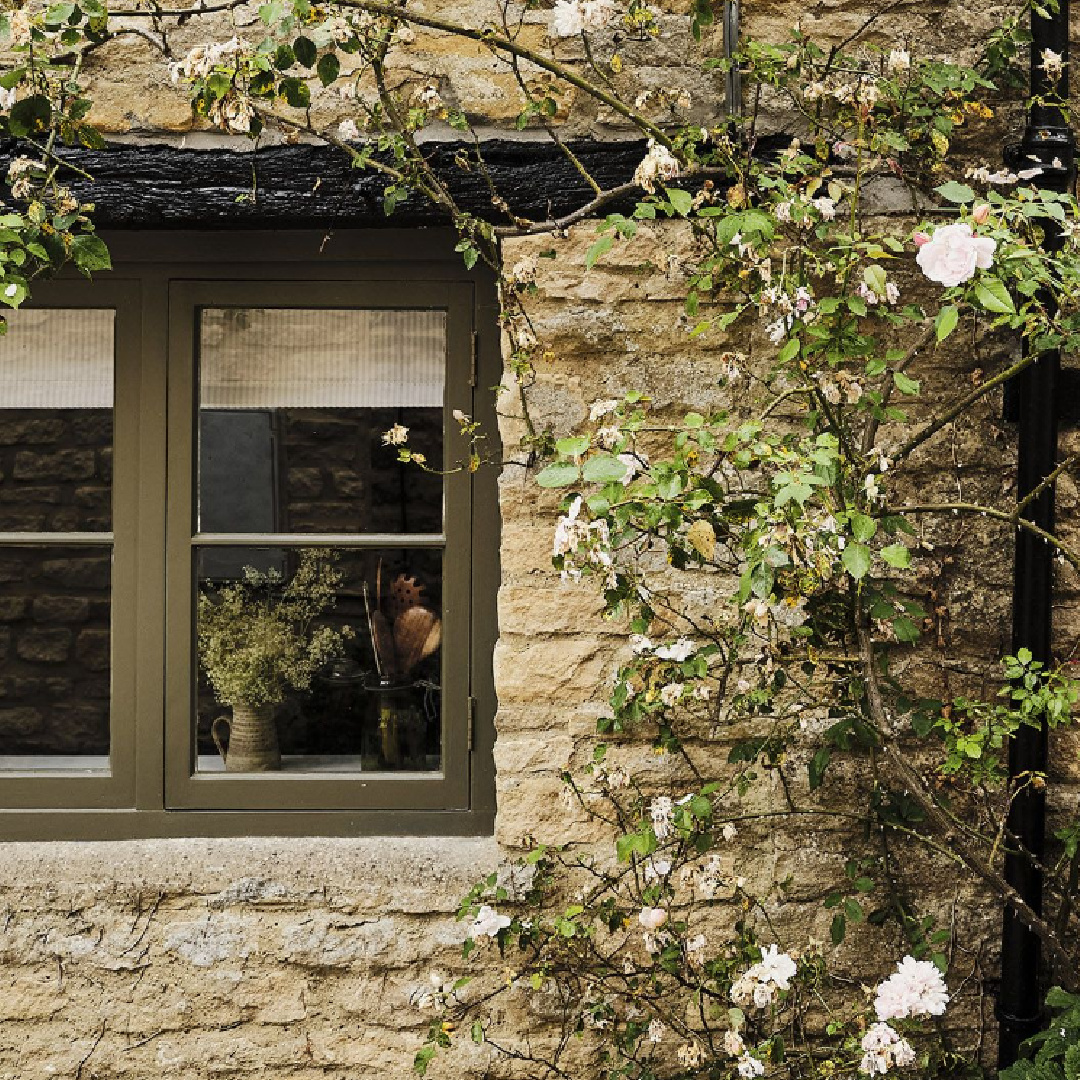 Rustic exterior of Cotswolds stone cottage called Armada Cottage. Dates to 1489 with reimagined interiors by Beth Dadswell (Imperfect Interiors).