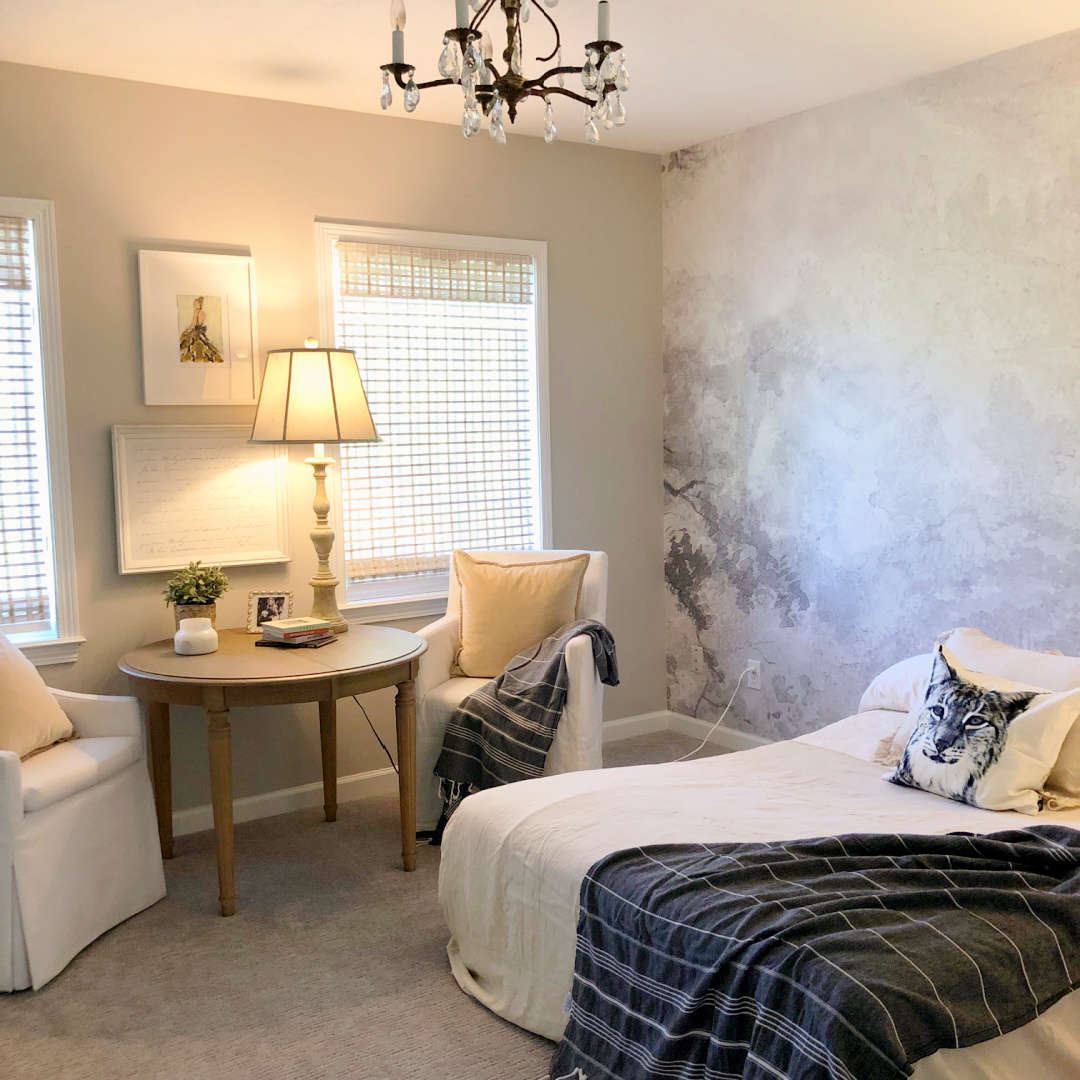 Hello Lovely's Scandinavian inspired guest bedroom with wallpaper mural and SW Agreeable Gray walls.