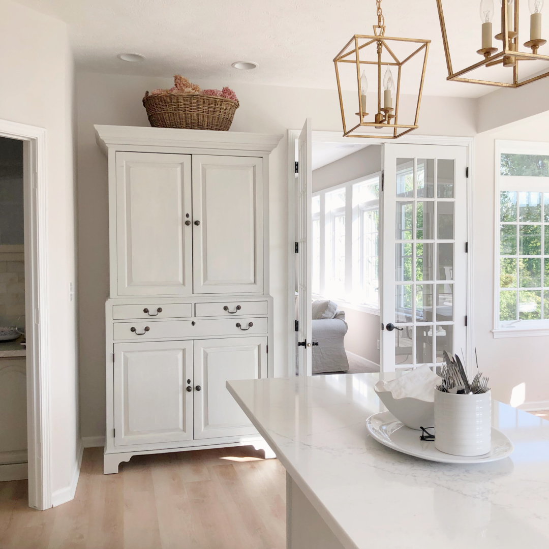 Hello Lovely's modern French kitchen with Darlana lanterns in gilded iron.