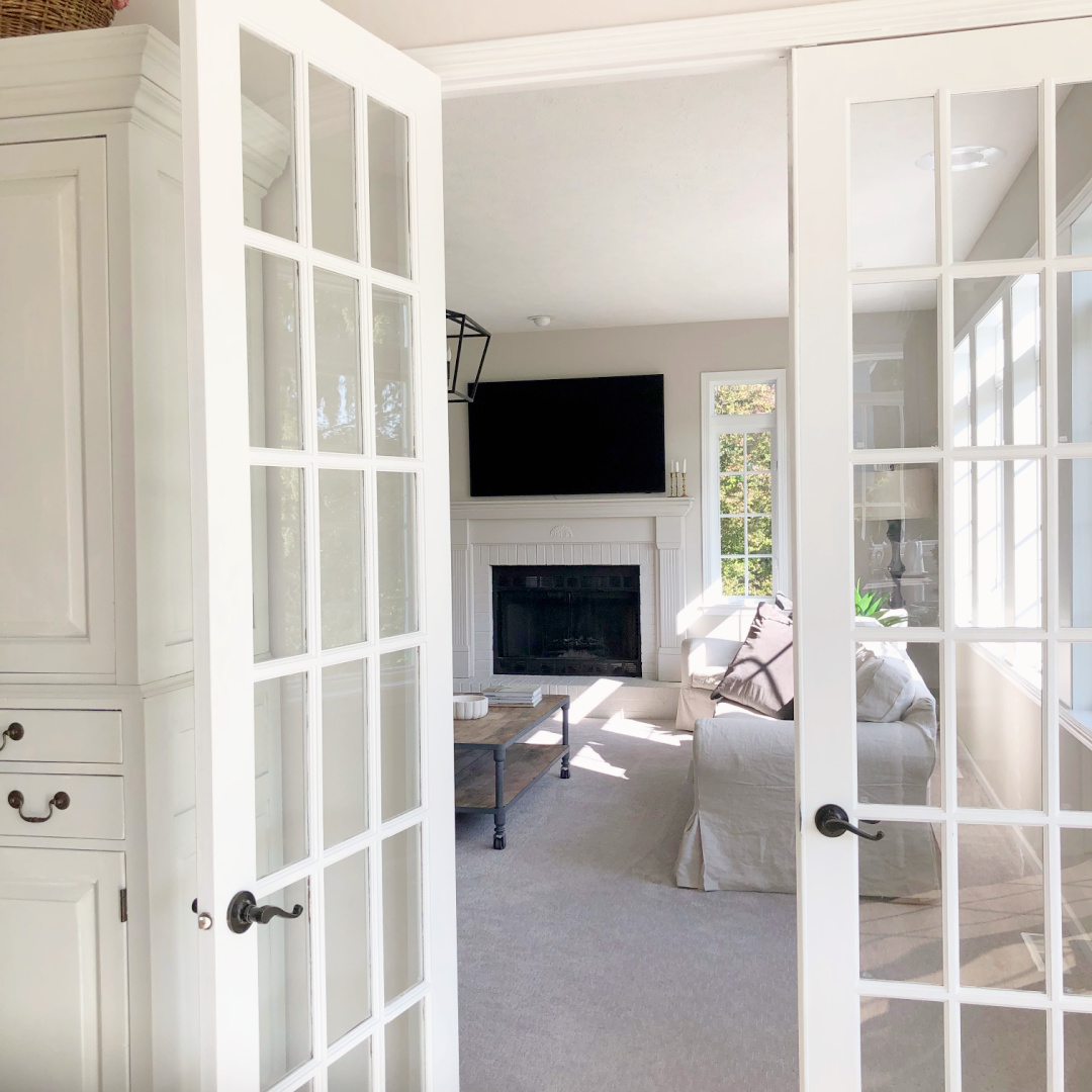 Hello Lovely's family room through French doors from kitchen.