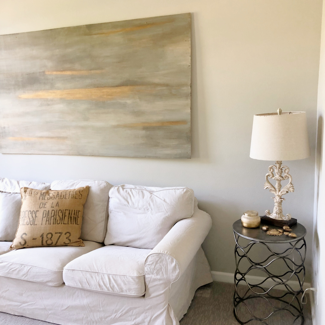 Hello Lovely's serene modern French living room with original abstract painting by Michele.
