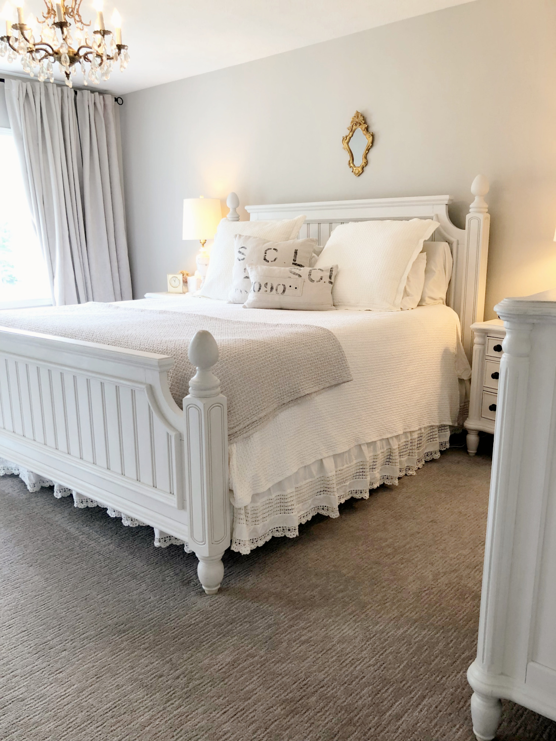 Hello Lovely's white bedroom with greige walls painted SW Agreeable Gray.