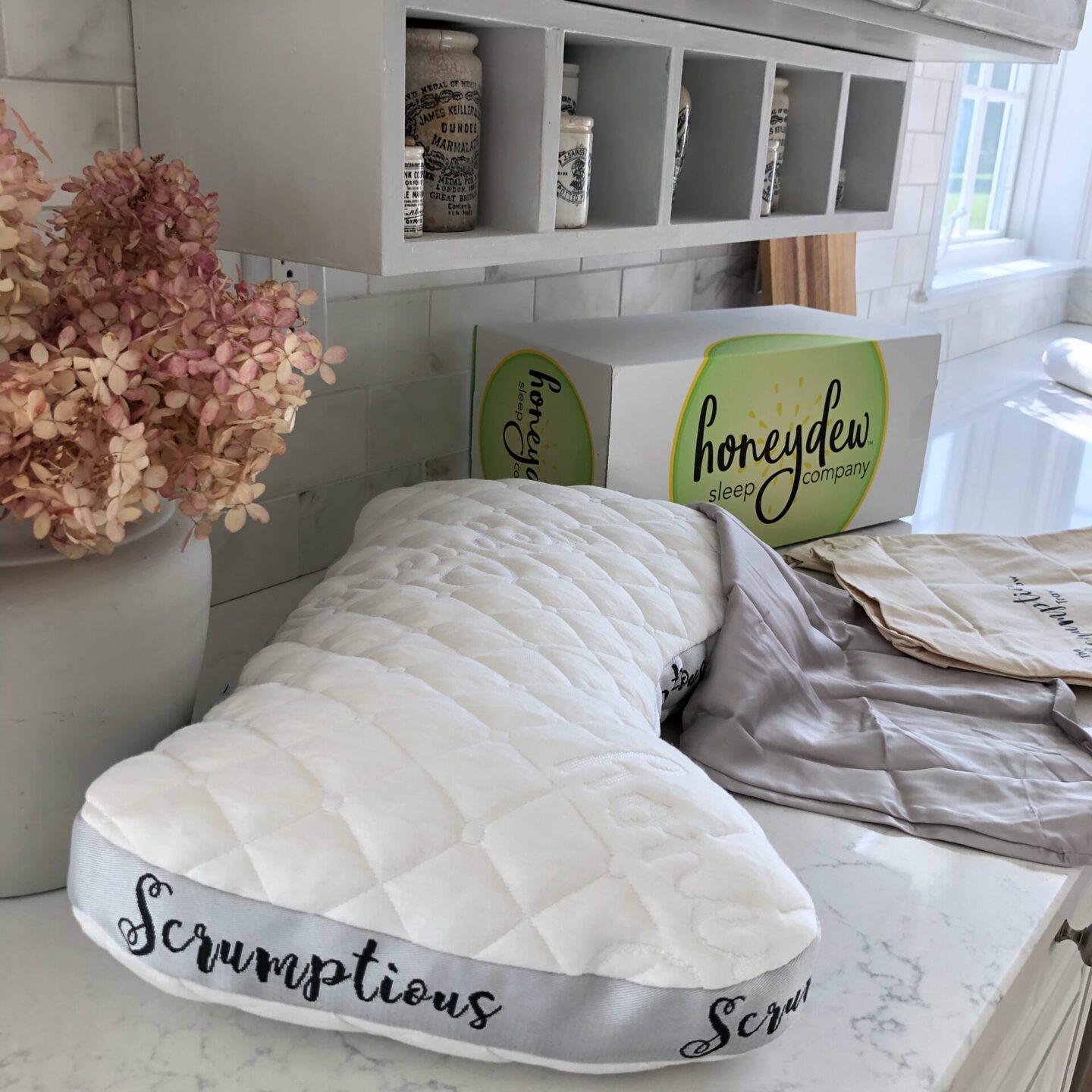 Honeydew Travel Pillow with Case and Pouch in Hello Lovely's home. #honeydewsleep