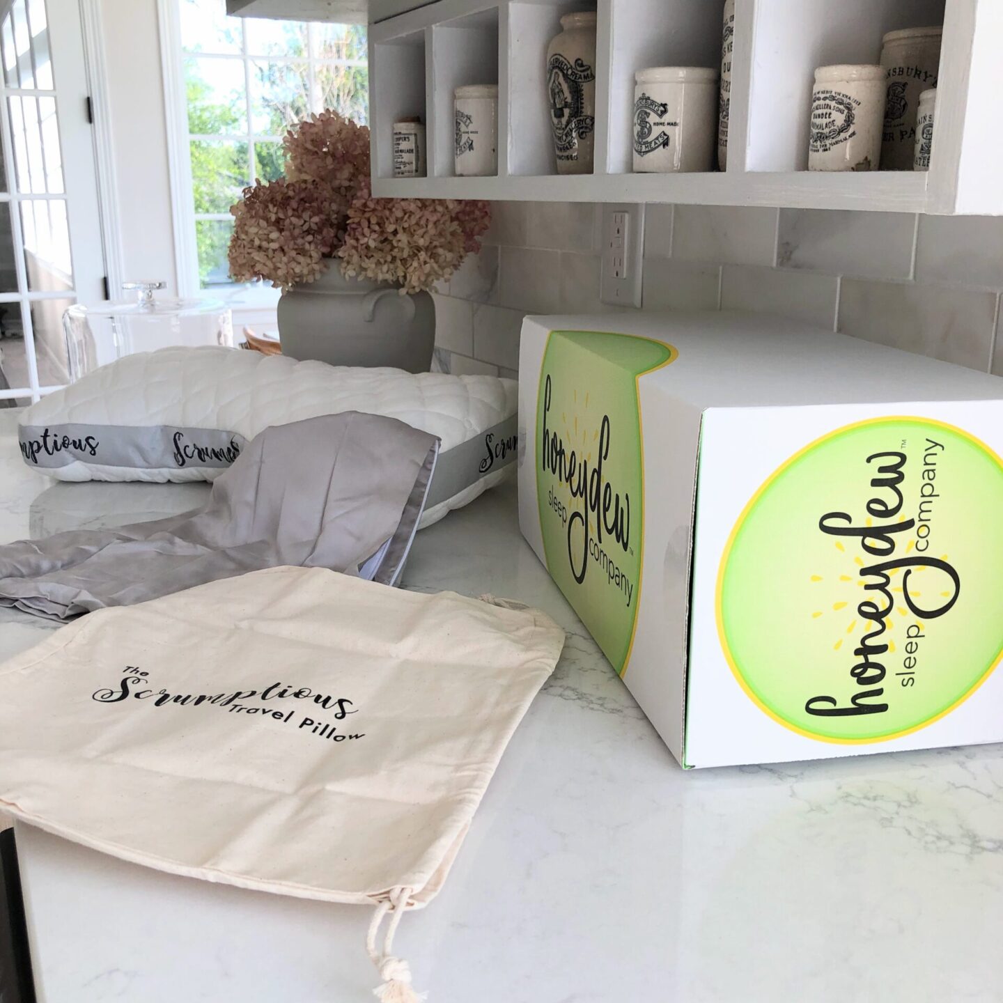 Honeydew Travel Pillow with Case and Pouch in Hello Lovely's home. #honeydewsleep
