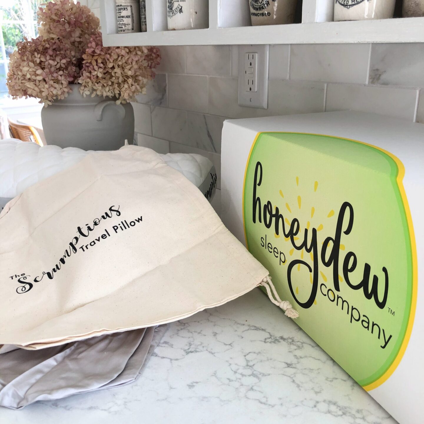 Honeydew Travel Pillow with Case and Pouch in Hello Lovely's home. #honeydewsleep