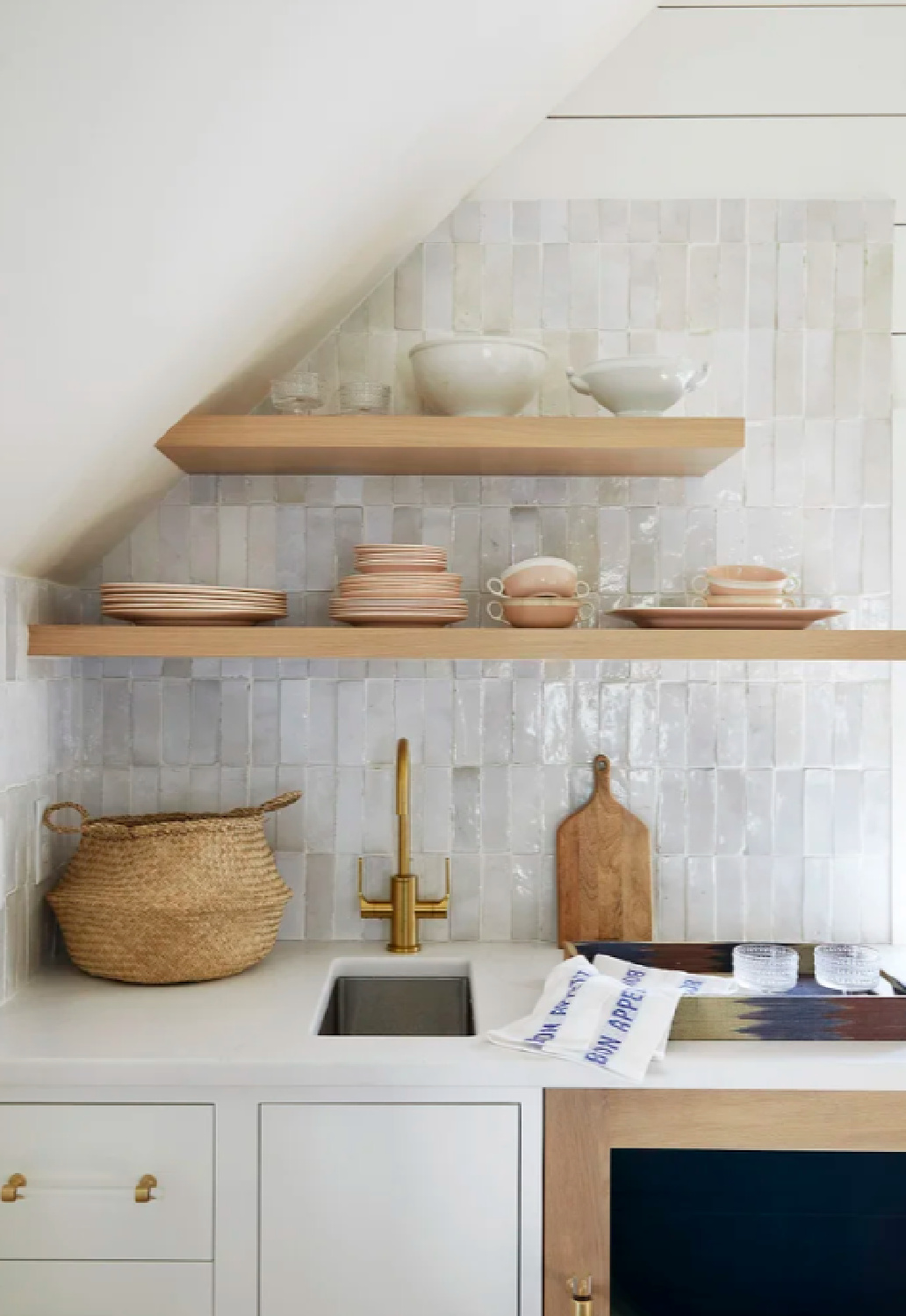 Beautiful neutral kitchen in Maine with floating shelving and Zellige tile - Nicola's Home.