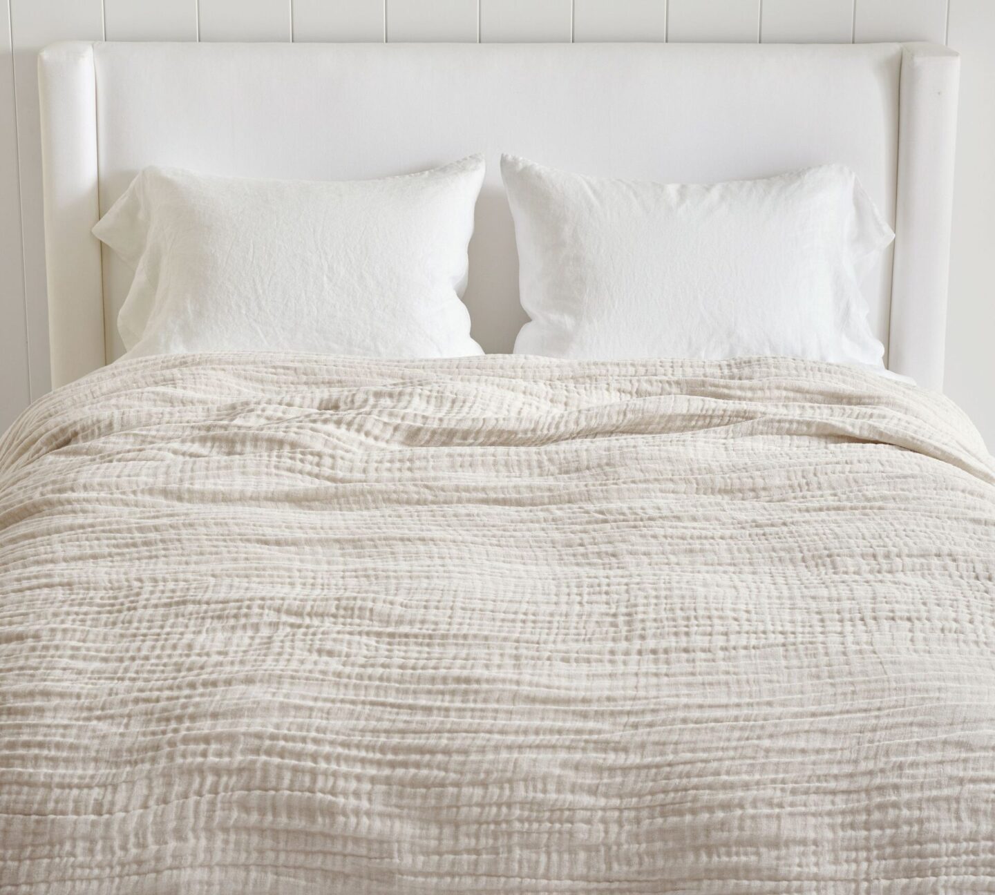 Cafe Au Lait Cloud Blanket (a gauzy breezy quilt on a dreamy bed with white wing style upholstered headboard, Pottery Barn.