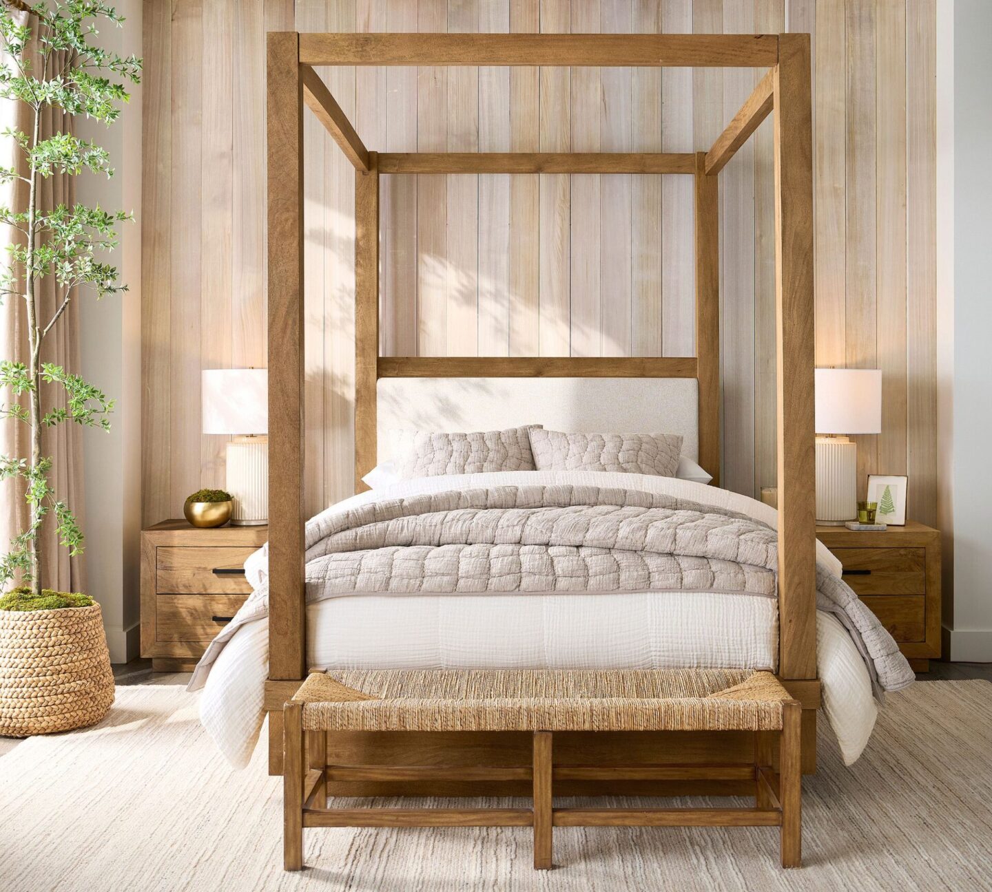 Pottery Barn bedroom with wood poster bed, rustic white wood wall, and Cloud Quilt.