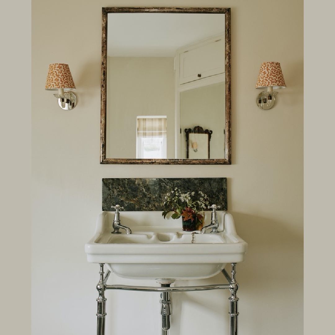 Beautiful cozy timeless English country bath with console sink and sconces with shades - design by Tamsin Saunders (HomeAndFound). #timelessinteriors