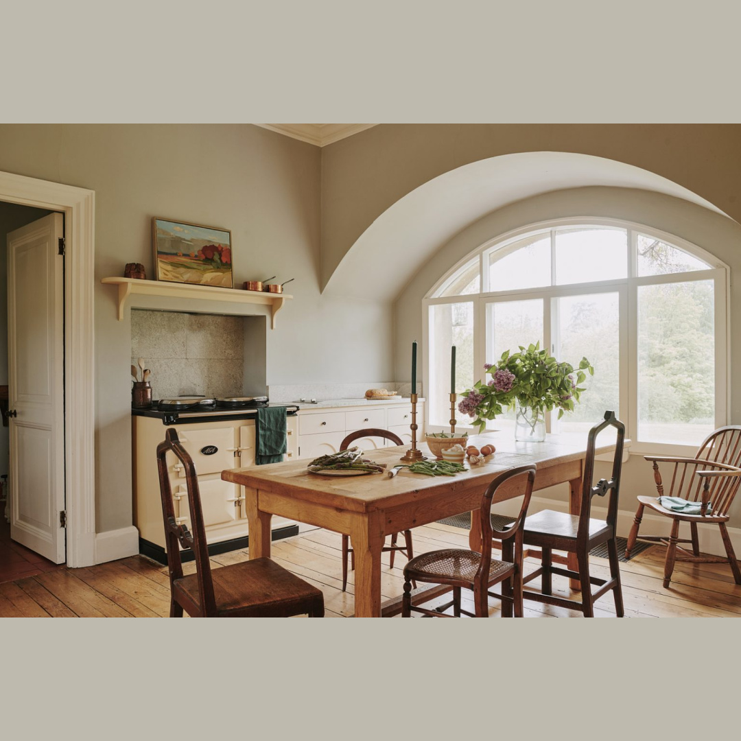Beautiful cozy timeless English country kitchen with stunning arched architectural window - by Tamsin Saunders (HomeAndFound). #timelessinteriors