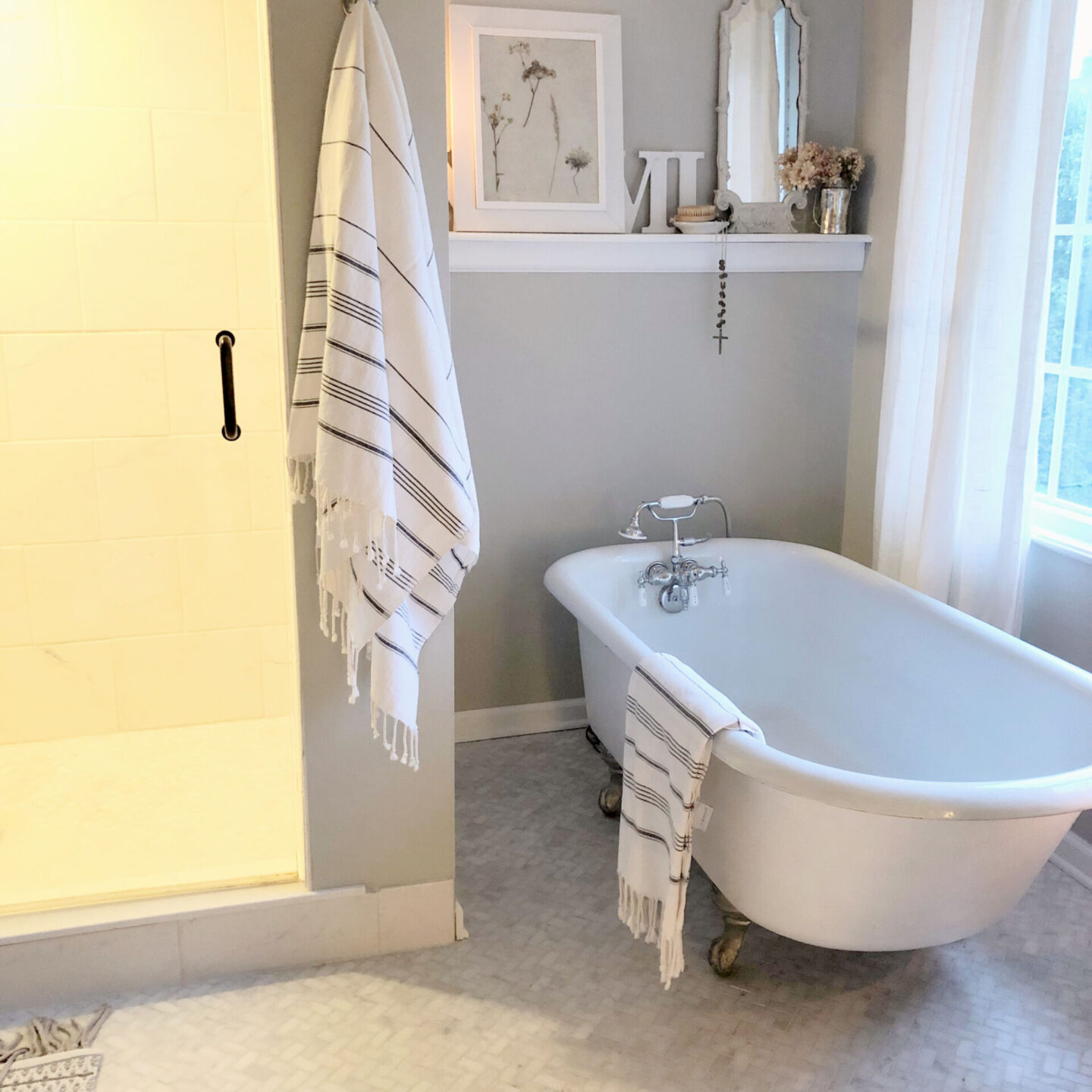 Hello Lovely's DIY renovated timeless serene bath at the Georgian with clawfoot tub and SW Repose Gray.