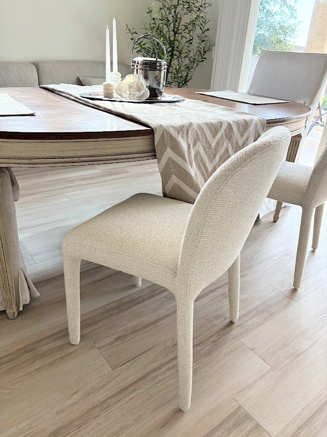 Curved back beige upholstered modern dining chairs - Hello Lovely.