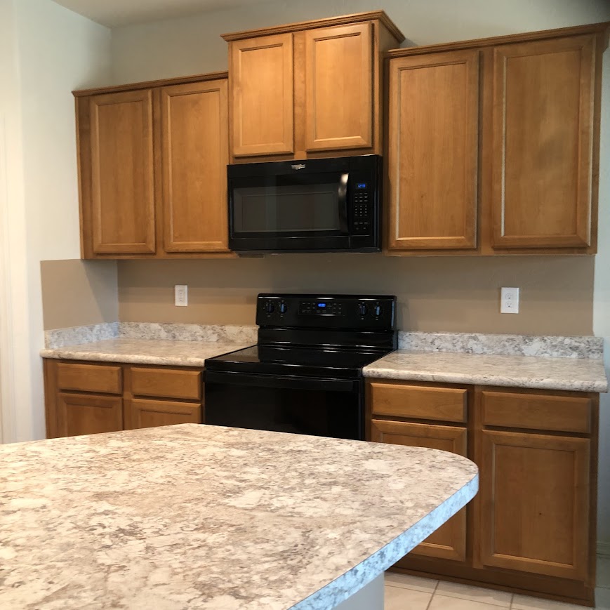 before: hello lovely's arizona snowbird kitchen before painting cabinets