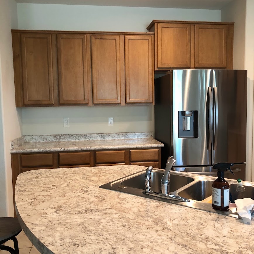before: hello lovely's arizona snowbird kitchen before painting cabinets
