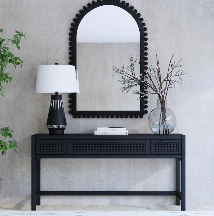 Black wood console table with arch mirror and lamp, Wayfair.