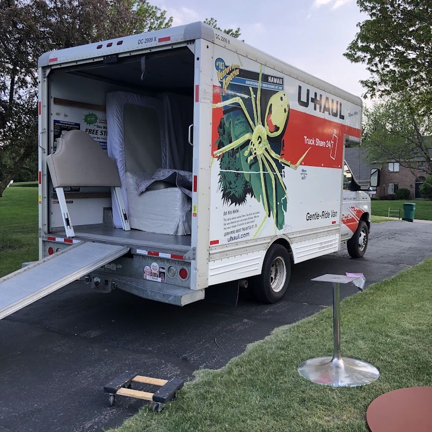 U-Haul rental truck in our driveway being loaded for the snowbird sanctuary - Hello Lovely.