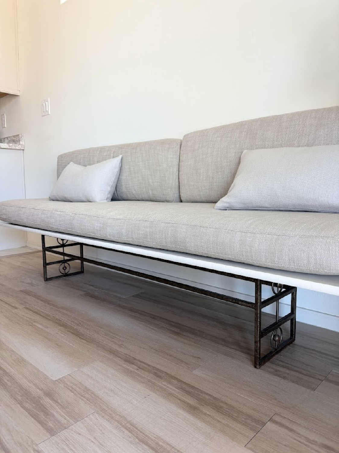 DIY banquette with linen cushion (RH) in Hello Lovely's snowbird sanctuary dining room with European country style.