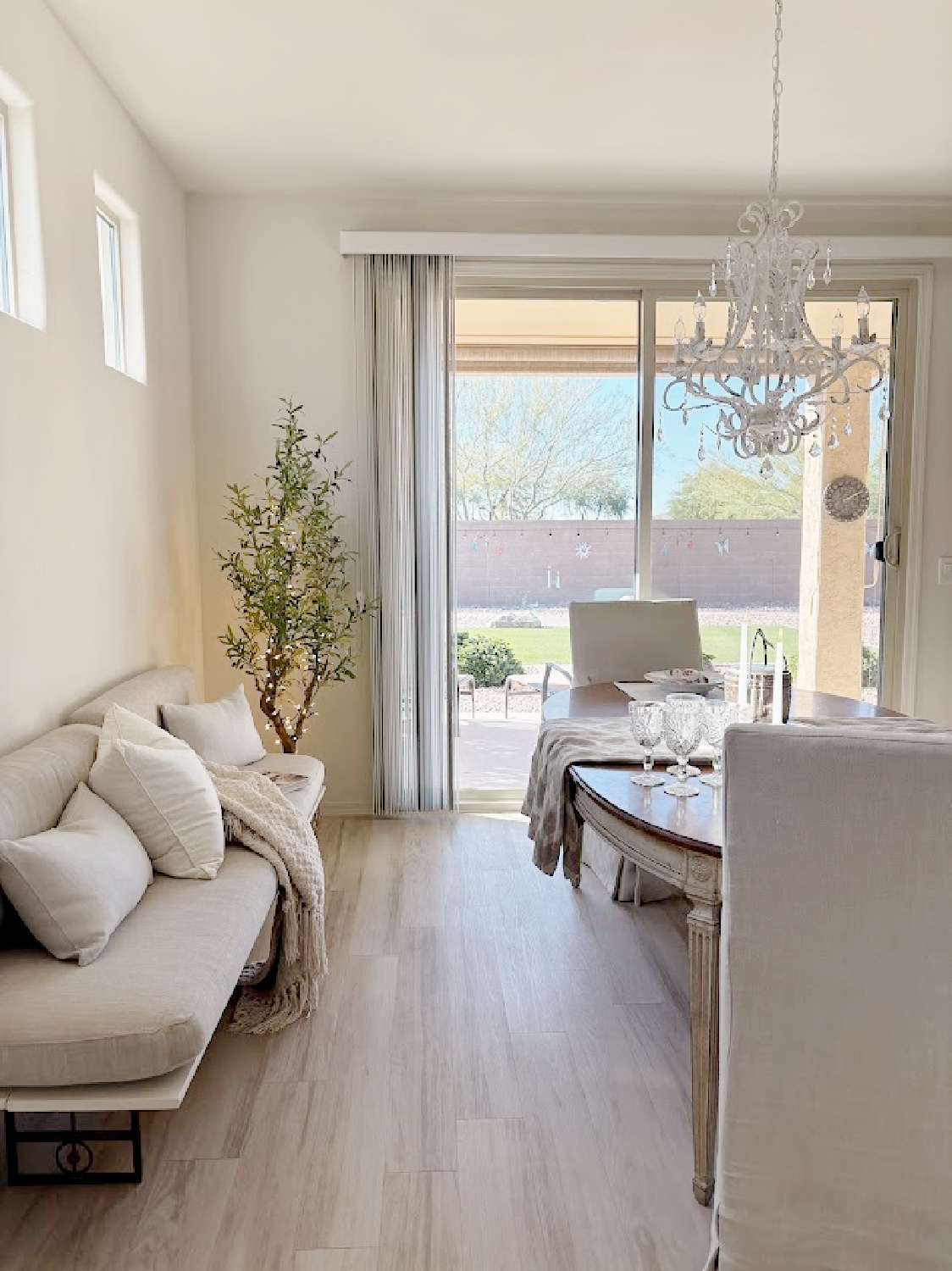 White oak LVP flooring in Hello Lovely's snowbird sanctuary dining room with European country style.