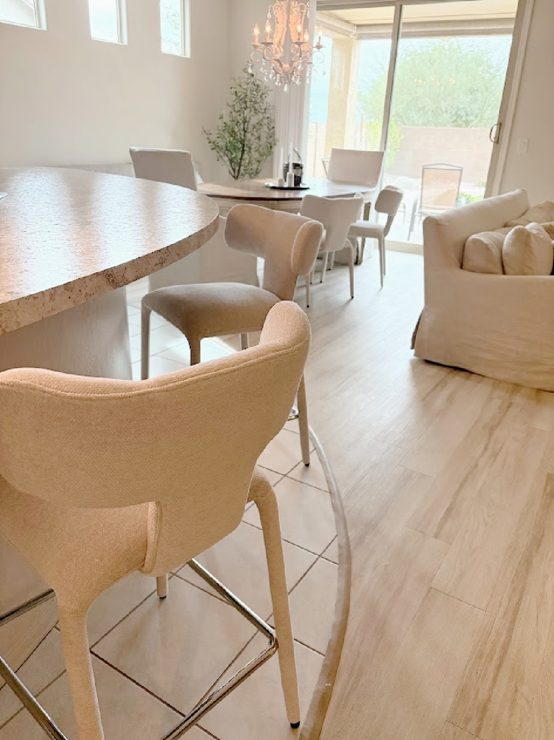 Modern beige counterstools (Wayfair) have upholstered legs. Open floorplan in our European country style snowbird home in Arizona - Hello Lovely.