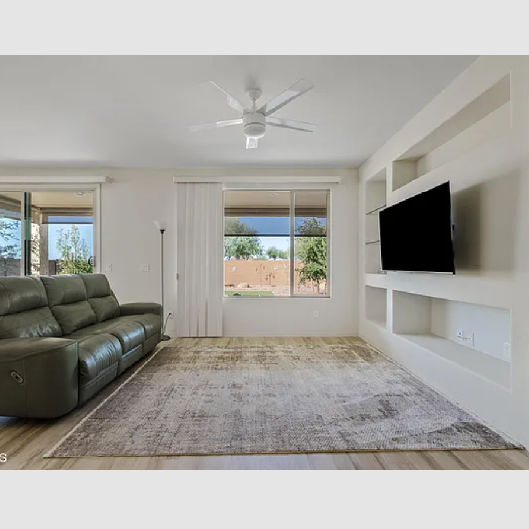 before - living room with built-ins in Hello Lovely's snowbird sanctuary Arizona home.