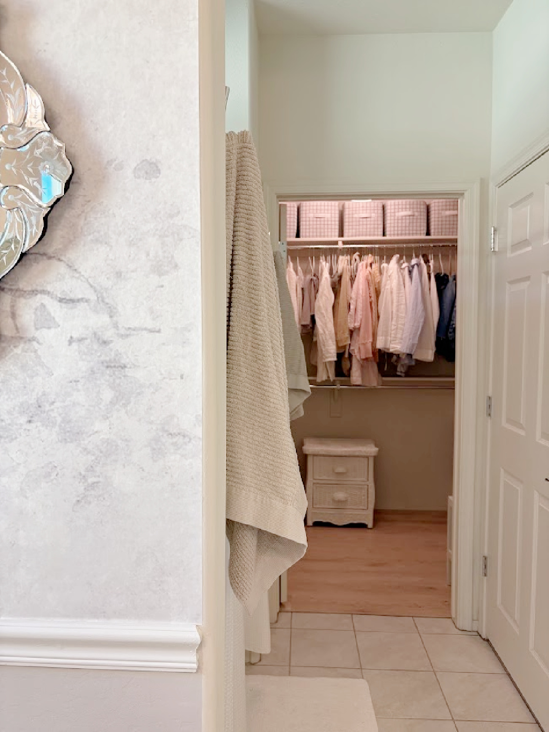 Our renovated bath at the snowbird Arizona house with SW Agreeable Gray painted vanity, lucite hardware, Venetian mirrors layered on a Photowall mural wallpaper, and rugs from Loloi x Amber Lewis - Hello Lovely Studio.