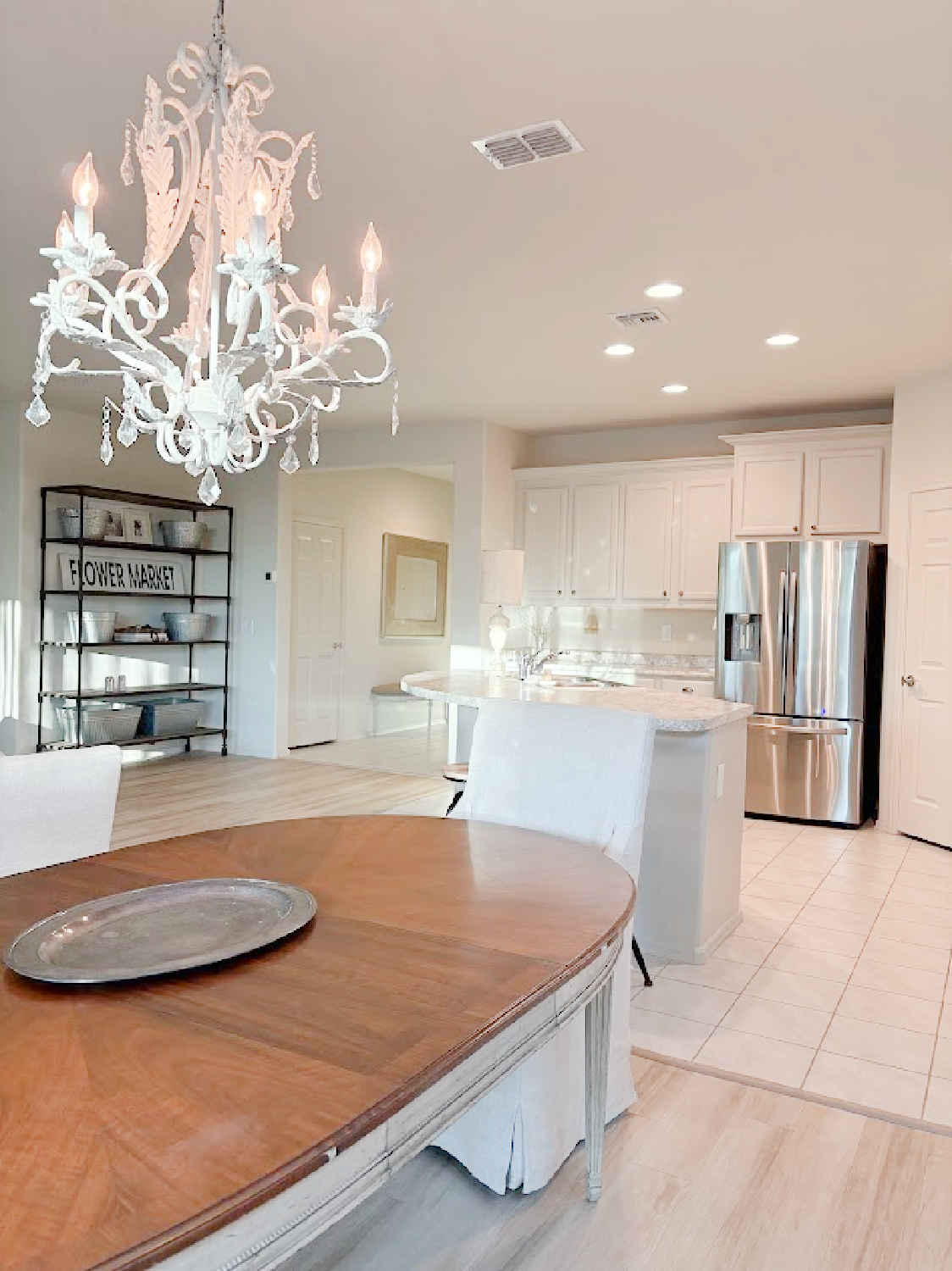 Open floorplan in our Arizona snowbird house where I painted kitchen cabinets SW Agreeable Gray - Hello Lovely Studio.