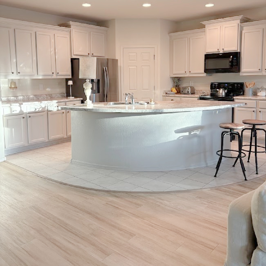 Open floorplan in our Arizona snowbird house where I painted kitchen cabinets SW Agreeable Gray - Hello Lovely Studio.