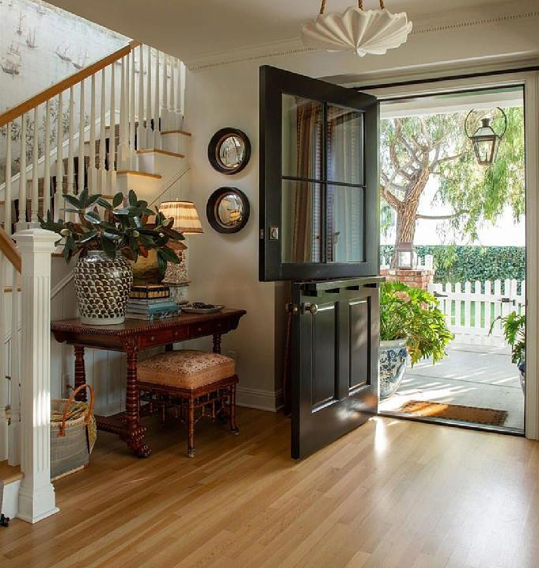Breathtaking entry with mural and Dutch door in Leslie Martin's stunning traditional coastal home 5735 Dolphin in La Jolla, CA with interiors by M+M Interior Design. Offered by @nelsonbrothersrealestate