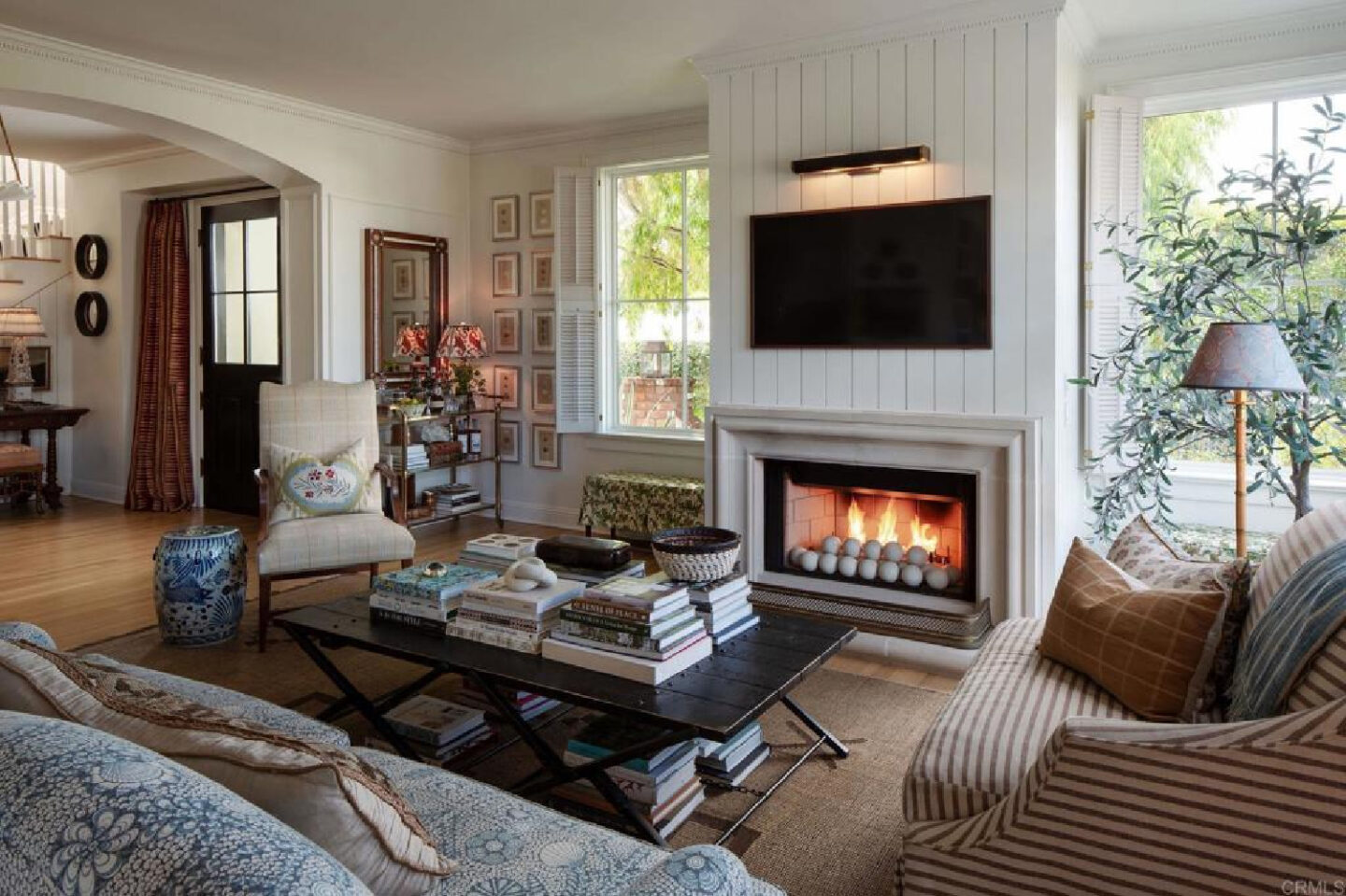 Cozy and comforting living room in Leslie Martin's stunning traditional coastal home 5735 Dolphin in La Jolla, CA with interiors by M+M Interior Design. Offered by @nelsonbrothersrealestate