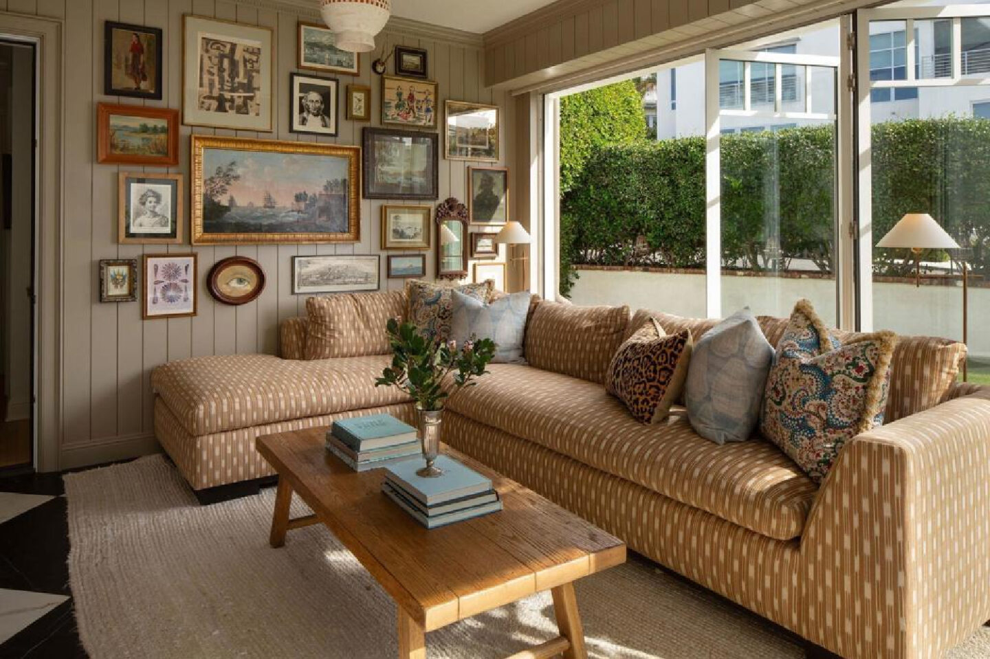 Leslie Martin's den with gallery wall in stunning traditional coastal home 5735 Dolphin in La Jolla, CA with interiors by M+M Interior Design. Offered by @nelsonbrothersrealestate