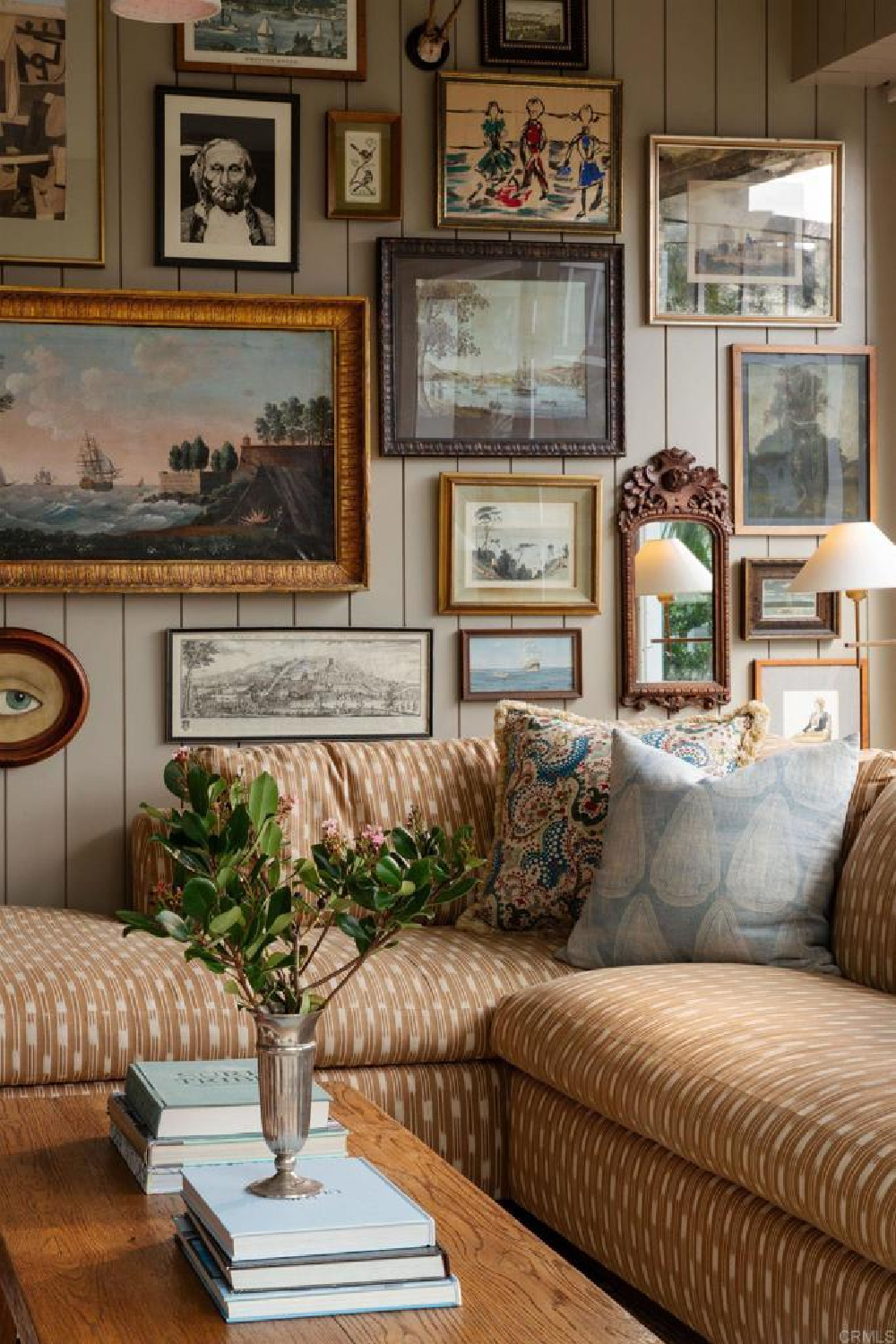 Gallery wall in chic den of Leslie Martin's stunning traditional coastal home 5735 Dolphin in La Jolla, CA with interiors by M+M Interior Design. Offered by @nelsonbrothersrealestate