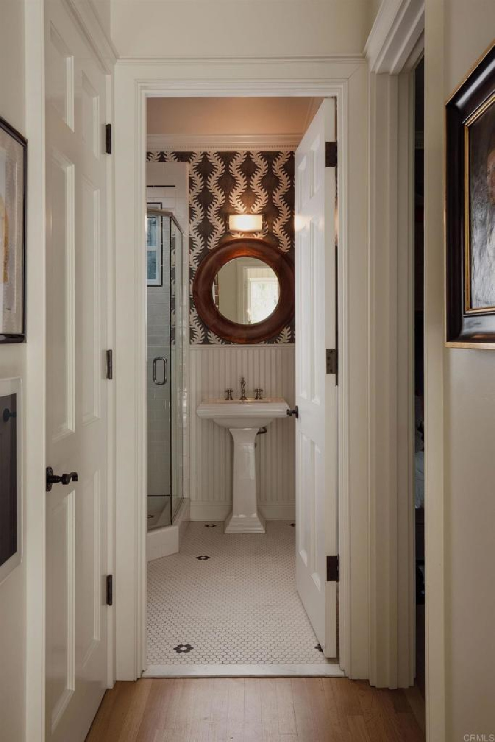 Bath with coastal style in Leslie Martin's stunning traditional coastal home 5735 Dolphin in La Jolla, CA with interiors by M+M Interior Design. Offered by @nelsonbrothersrealestate