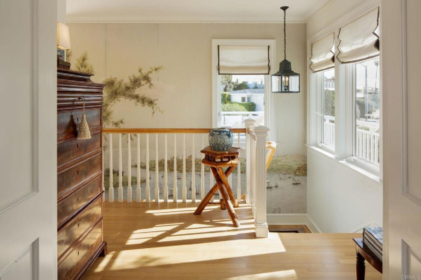 Staircase with Iksel mural at stunning traditional coastal home 5735 Dolphin in La Jolla, CA with interiors by M+M Interior Design. Offered by @nelsonbrothersrealestate
