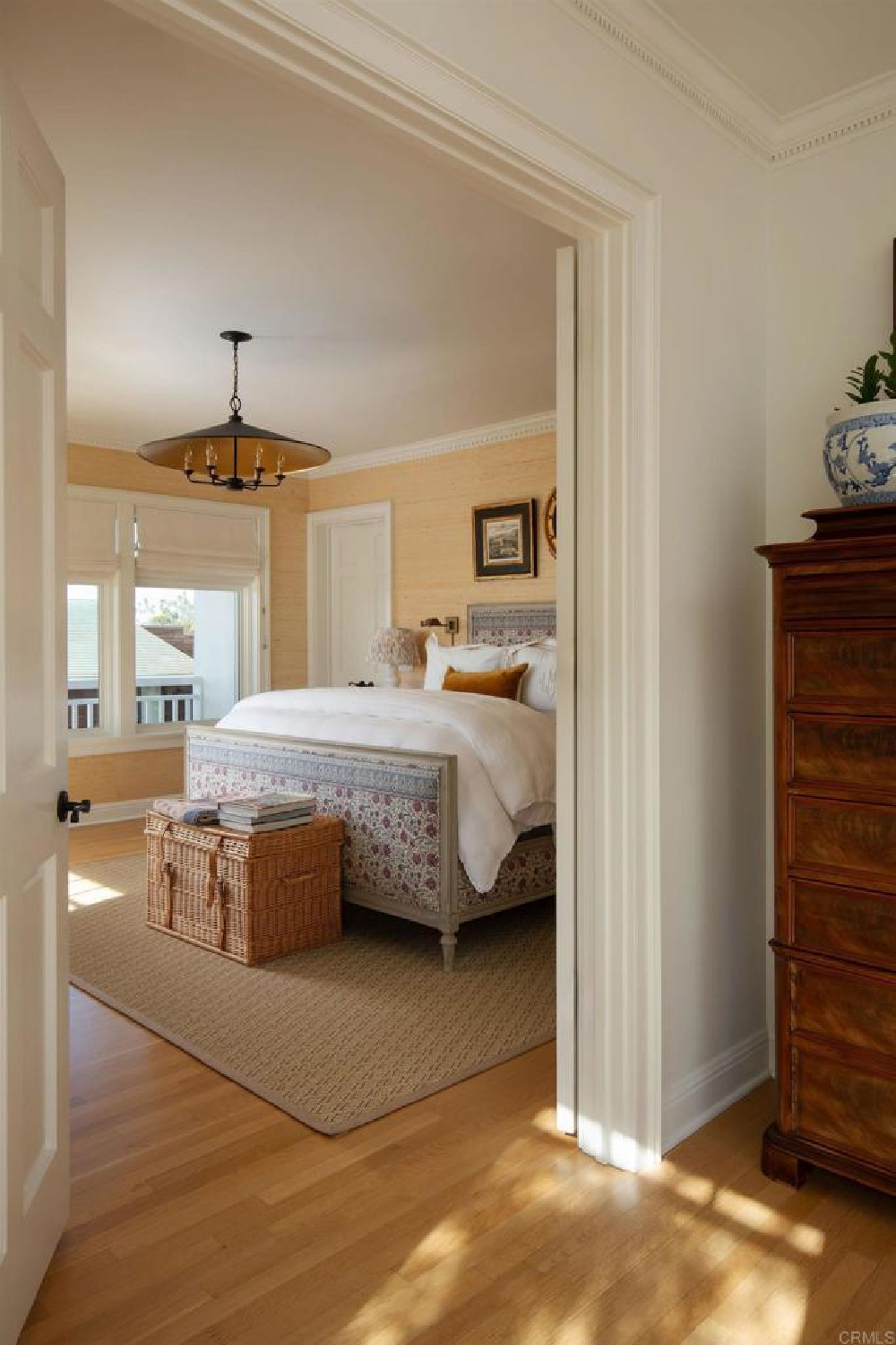 Grasscloth wallpaper in Leslie Martin's bedroom in stunning traditional coastal home 5735 Dolphin in La Jolla, CA with interiors by M+M Interior Design. Offered by @nelsonbrothersrealestate