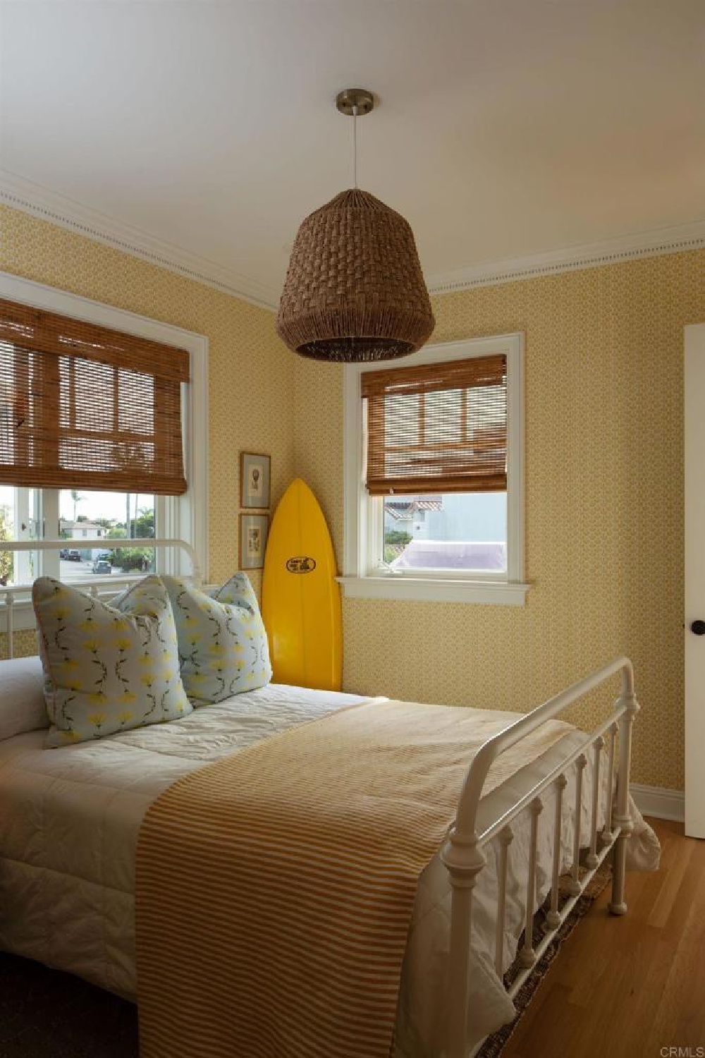 Bedroom with surf board in stunning traditional coastal home 5735 Dolphin in La Jolla, CA with interiors by M+M Interior Design. Offered by @nelsonbrothersrealestate