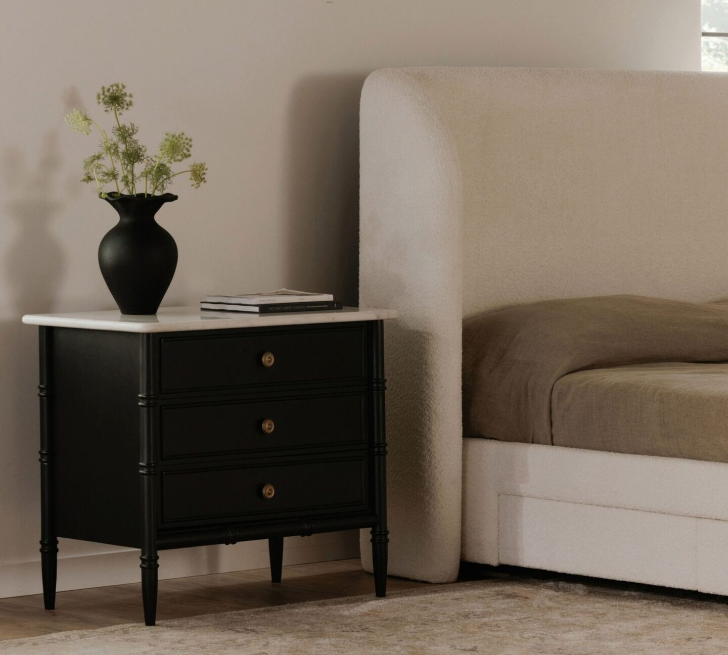 Adrien nighstand with marble top in chic serene black and ivory bedroom, Pottery Barn.