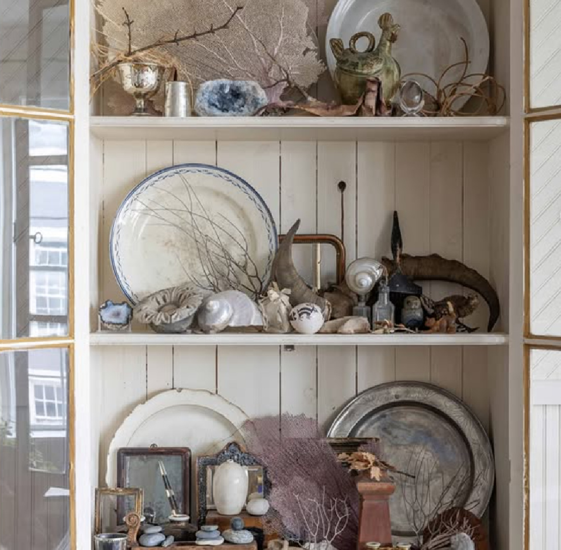 Antique country cabinet with collected treasures from @redchair_hudson - Lonny magazine.