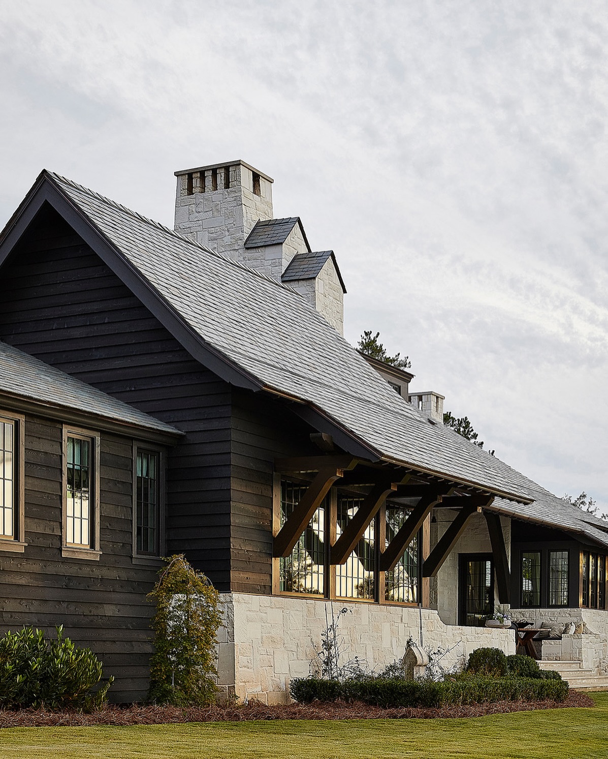 Jeffrey Dungan designed lake house with twin gabled chimney.