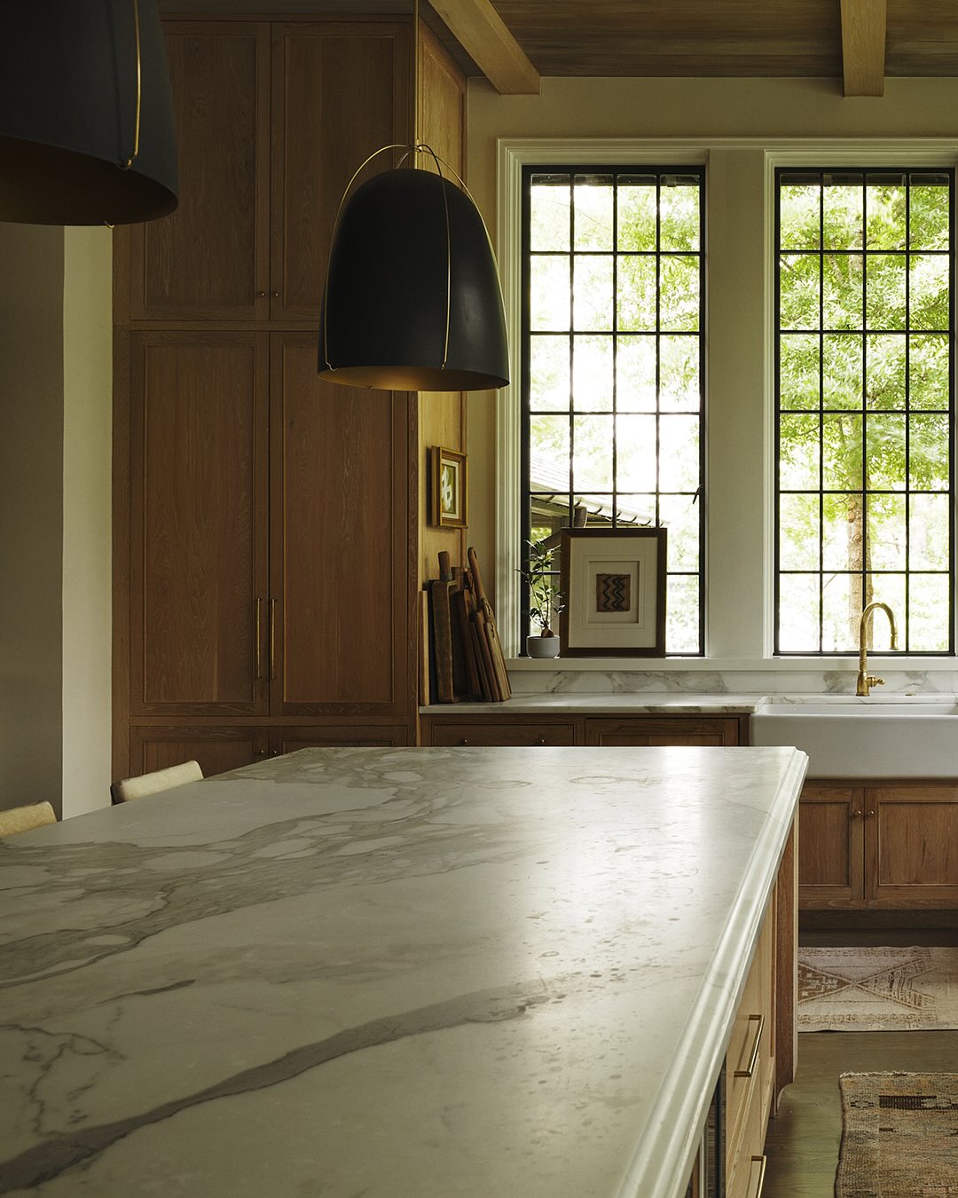 Jeffrey Dungan designed kitchen with tall windows to counter allowing nature inside - photo @a_gaut.