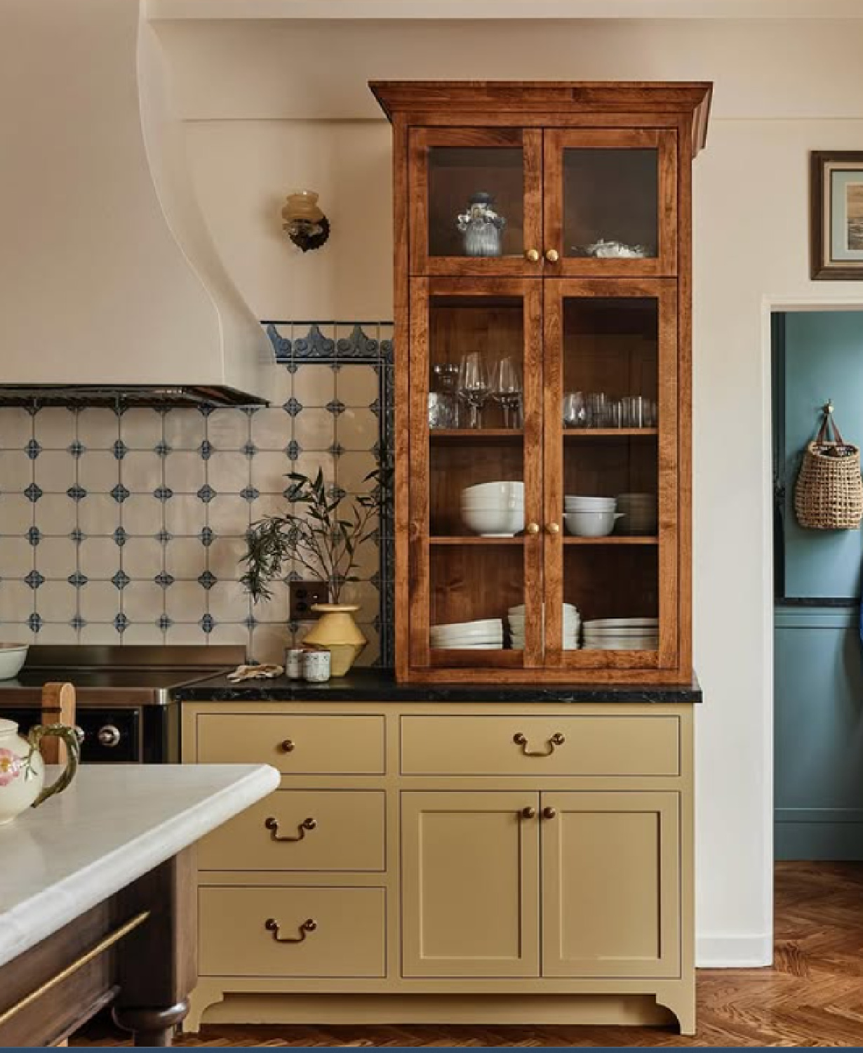 Farrow & Ball Slipper Satin on walls, Hay on cabinets, and custom Delft tile backsplash in bespoke kitchen by Jamie Haller in AD (photo by Jenna Peffley). #farrowandballslippersatin #farrowandballhay