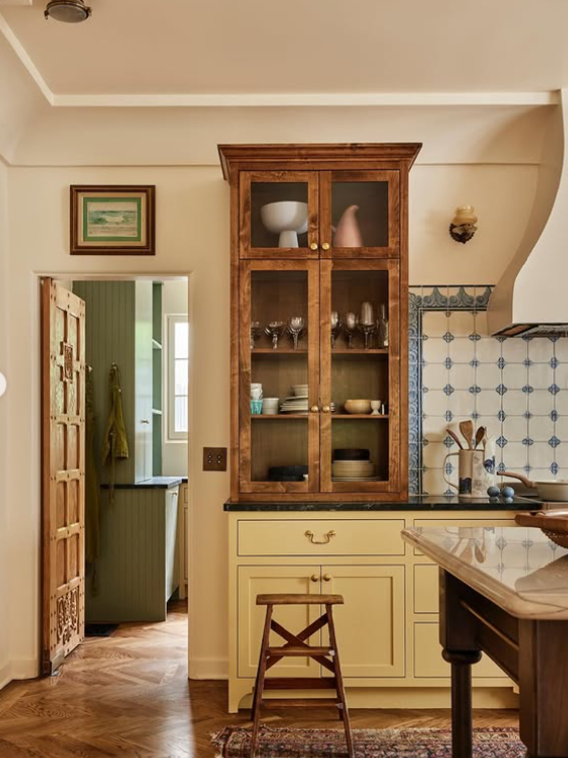 Farrow & Ball Slipper Satin on walls, Hay on cabinets, and custom Delft tile backsplash in bespoke kitchen by Jamie Haller in AD (photo by Jenna Peffley). #farrowandballslippersatin #farrowandballhay