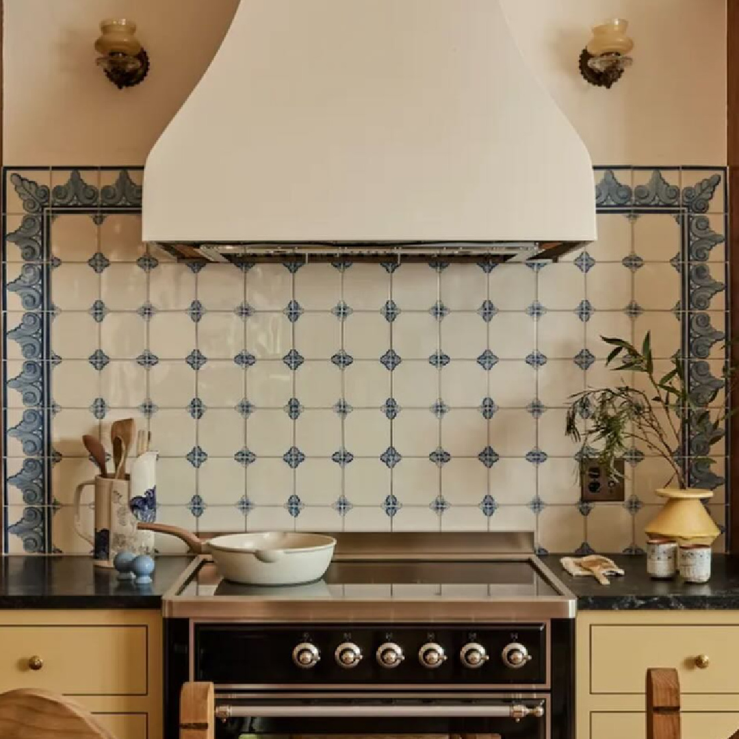 Custom delft tile at range (Bertazzoni) in Jamie Haller designed bespoke kitchen for a Spanish Colonial LA home in AD (photo: Jenna Peffley). Cabinets are painted F&B Hay.