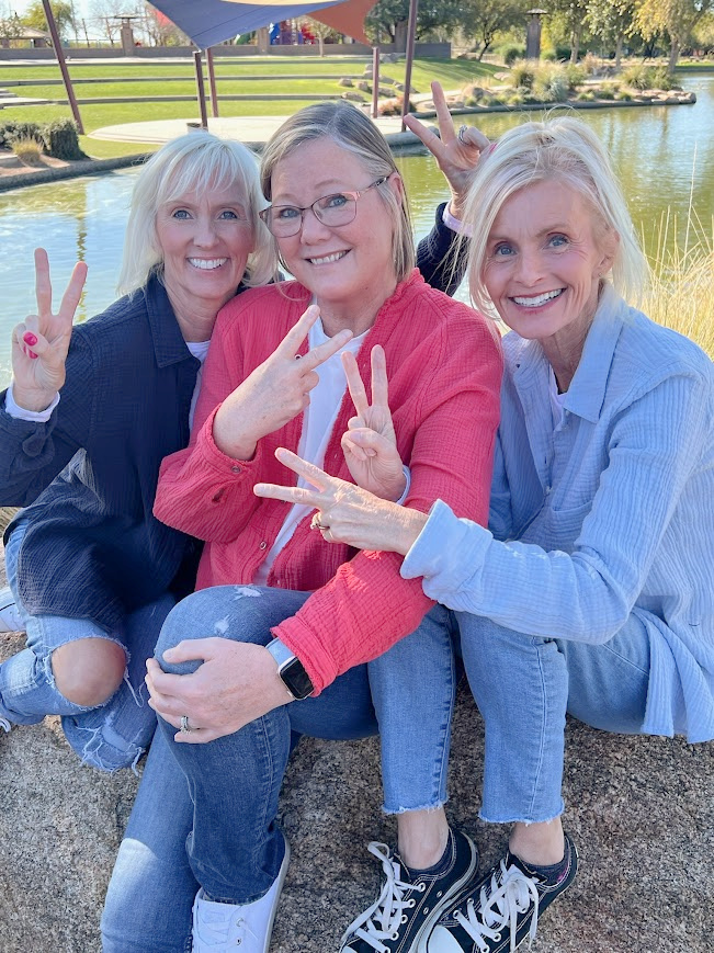 Michele of Hello Lovely Studio with sister and friend at pond.