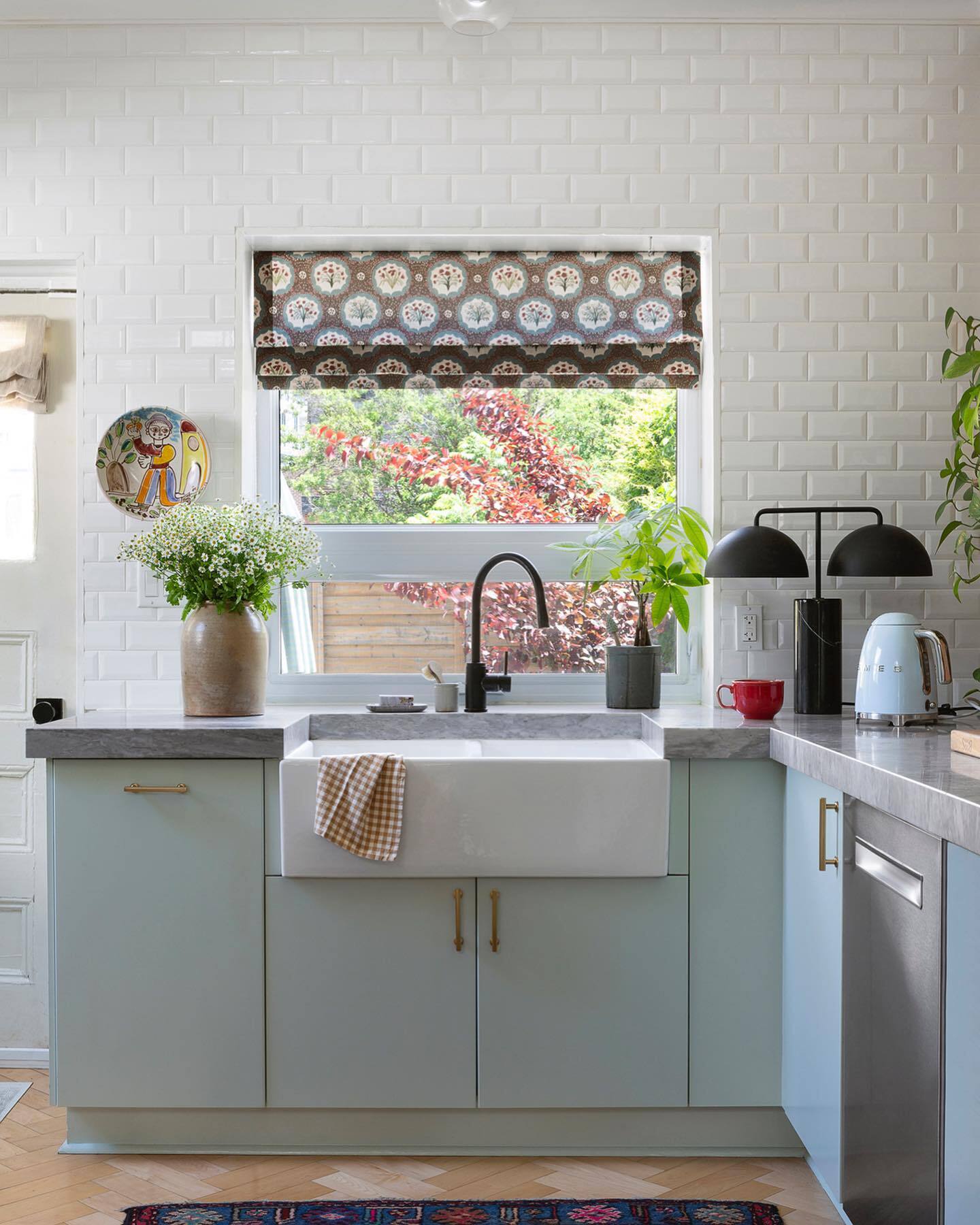 Beautiful english country style kitchen with cabinetry painted Farrow & Ball Teresa's Green. #teresasgreen