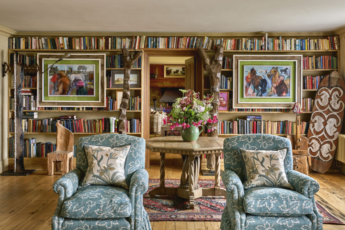 Enchanting colorful library with blue patterened club chairs - KIT KEMP Design Stories (Rizzoli, 2026)
