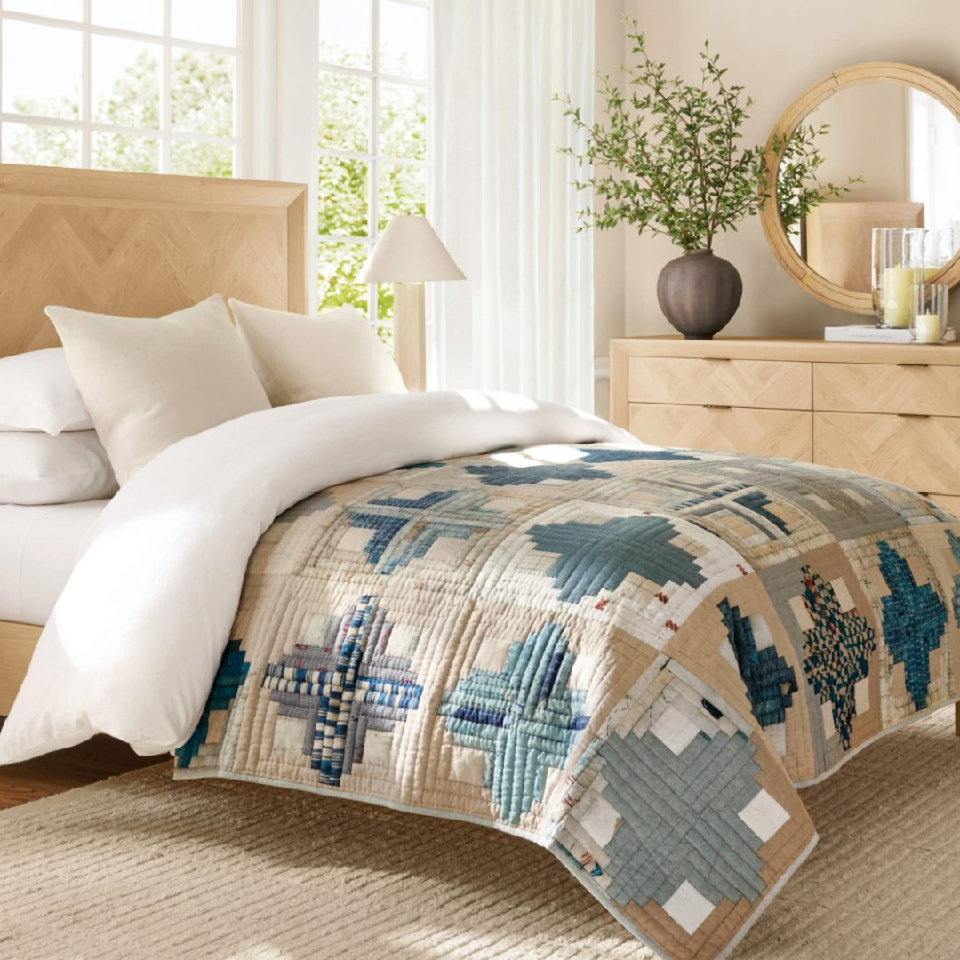 Gorgeous quilt with blue in light filled bedroom from Pottery Barn's Spring Look Book for 2026.