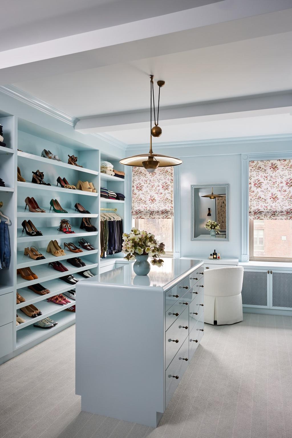 Blue dressing room closet with island - Vogue Living.