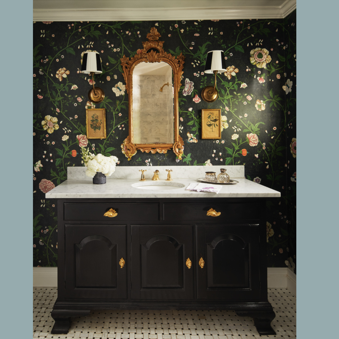 Chinoiserie chic handpainted black floral wallpaper in a bath with black vanity, gold hardware, and classic design by Brittany Bromley in RELAXED ELEGANCE (Rizzoli, 2025).