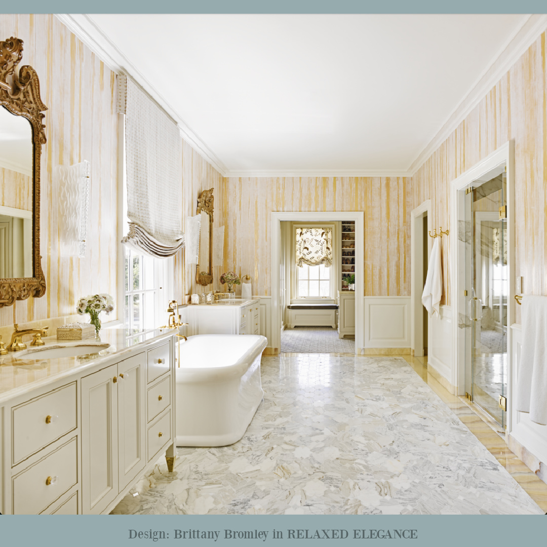Magnificent yellow wallpaper in a bath with soaking tub and classic design by Brittany Bromley in RELAXED ELEGANCE (Rizzoli, 2025).